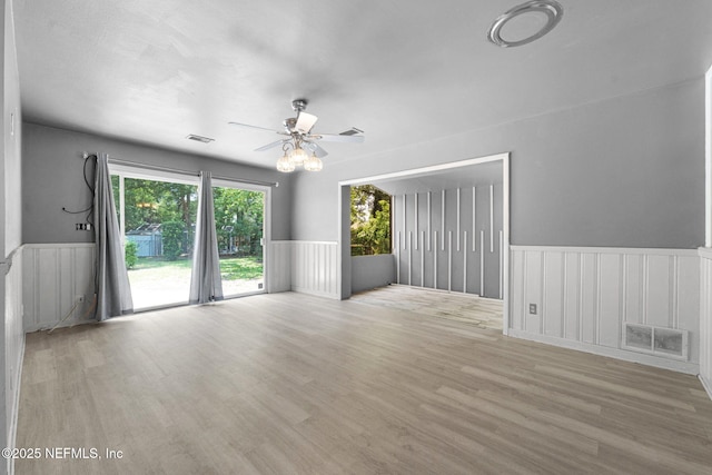 7930 Bellemeade Blvd, Jacksonville, FL 32211 - unfurnished room featuring wainscoting, wood finished floors, and ceiling fan