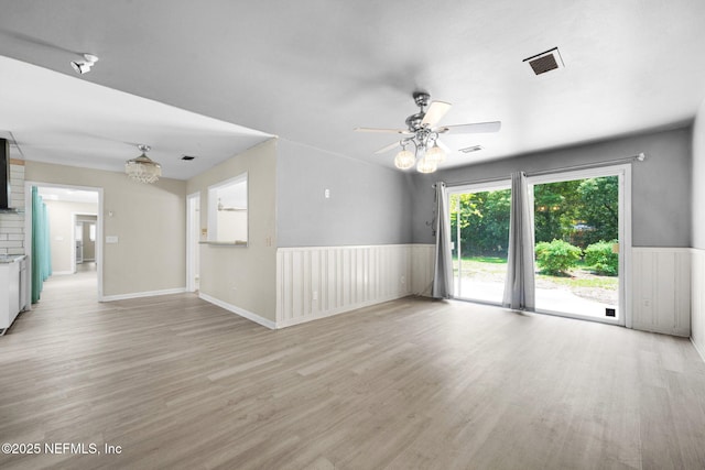 7930 Bellemeade Blvd, Jacksonville, FL 32211 - unfurnished living room with light wood finished floors and a ceiling fan