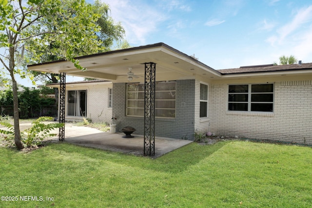 7930 Bellemeade Blvd, Jacksonville, FL 32211 - back of property with a patio, brick siding, a yard, and ceiling fan