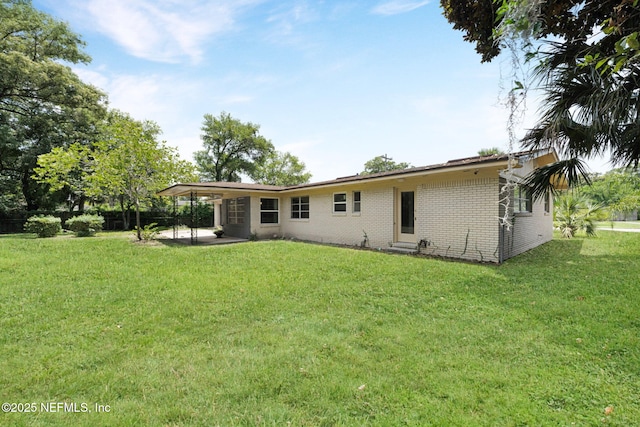 7930 Bellemeade Blvd, Jacksonville, FL 32211 - rear view of house with a patio, brick siding, and a lawn