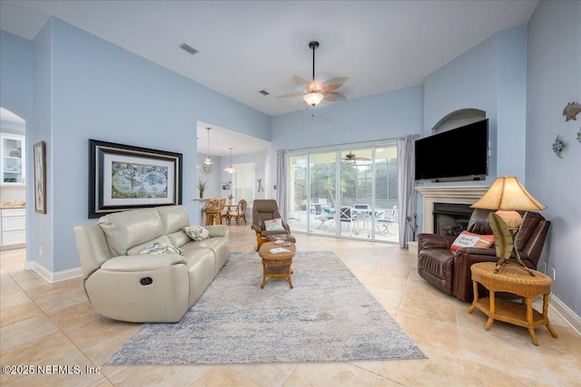 7 Rollins Dunes Dr, Palm Coast, FL 32137 - living area featuring ceiling fan, light tile patterned flooring, baseboards, and a fireplace