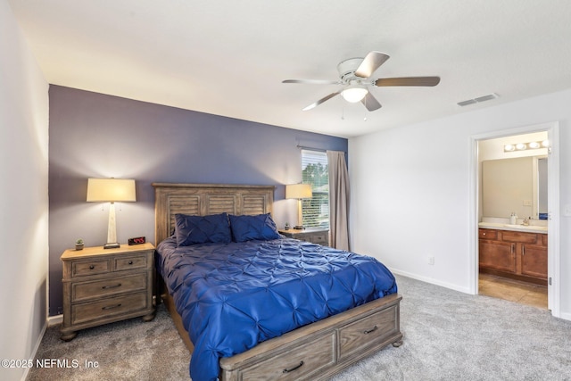 236 Servia Dr, Saint Johns, FL 32259 - bedroom with carpet flooring, a sink, baseboards, ensuite bathroom, and a ceiling fan