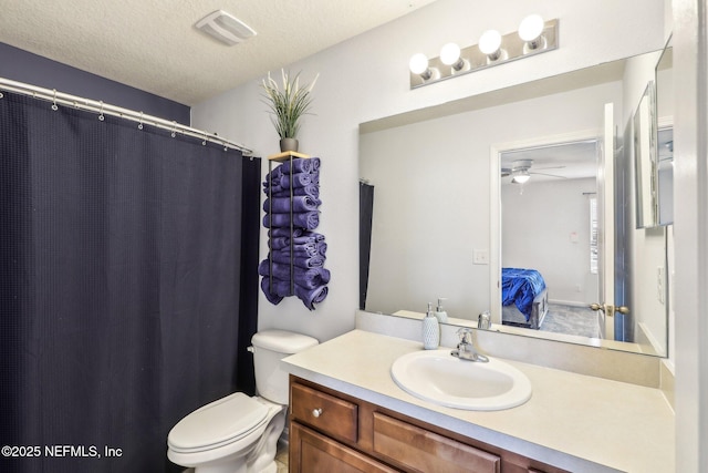 236 Servia Dr, Saint Johns, FL 32259 - bathroom with ensuite bathroom, toilet, vanity, a ceiling fan, and a textured ceiling