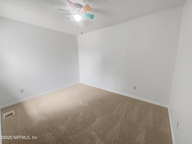 1127 Romaine Cir W, Jacksonville, FL 32225 - unfurnished room with carpet floors, ceiling fan, a textured ceiling, and baseboards