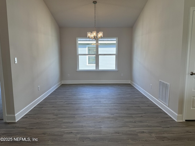 8322 Helmsley Blvd, Jacksonville, FL 32219 - unfurnished dining area featuring a chandelier, dark wood finished floors, and baseboards