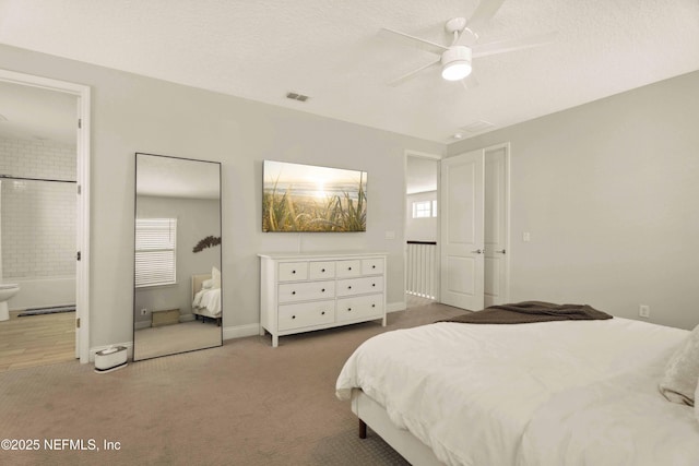 228 Waterline Dr, Saint Johns, FL 32259 - carpeted bedroom featuring multiple windows, ensuite bathroom, baseboards, and a textured ceiling