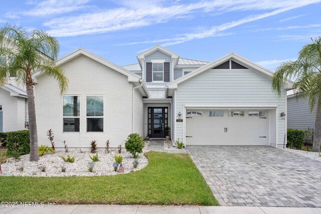 228 Waterline Dr, Saint Johns, FL 32259 - view of front of property with an attached garage, decorative driveway, and a front lawn