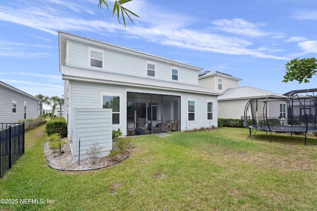 228 Waterline Dr, Saint Johns, FL 32259 - rear view of house with a trampoline, metal roof, and a sunroom