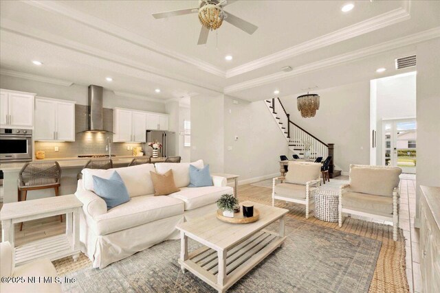 228 Waterline Dr, Saint Johns, FL 32259 - living area with recessed lighting, crown molding, stairs, a ceiling fan, and light wood-style flooring