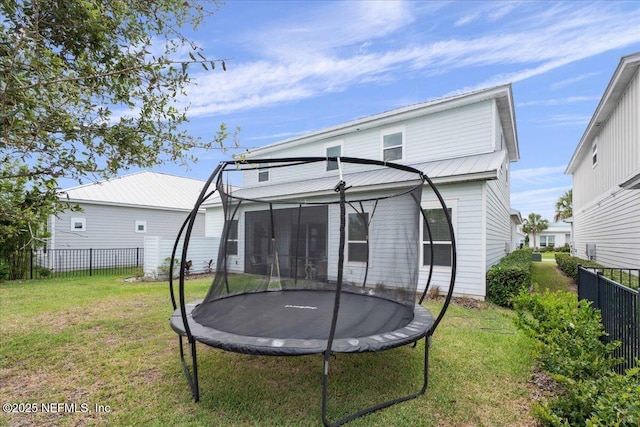 228 Waterline Dr, Saint Johns, FL 32259 - rear view of house featuring a trampoline and metal roof