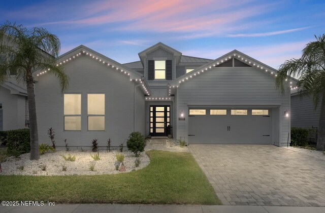 228 Waterline Dr, Saint Johns, FL 32259 - view of front of property featuring decorative driveway, an attached garage, and a front lawn