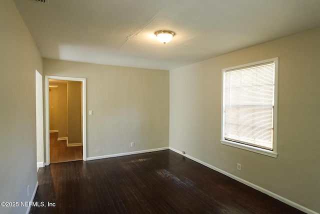 3763 Valley Rd, Jacksonville, FL 32207 - unfurnished room with dark wood-type flooring and baseboards