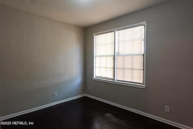 3763 Valley Rd, Jacksonville, FL 32207 - unfurnished room with dark wood-type flooring and baseboards