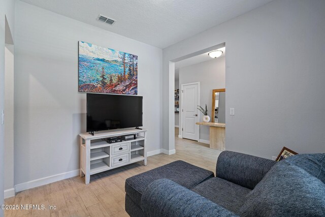 90 Lancelot Dr, Palm Coast, FL 32137 - living area with light wood-type flooring and baseboards
