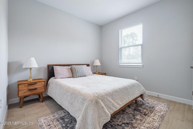 90 Lancelot Dr, Palm Coast, FL 32137 - bedroom featuring light wood-style floors and baseboards