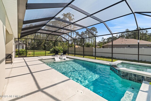 90 Lancelot Dr, Palm Coast, FL 32137 - view of pool featuring a patio, a pool with connected hot tub, and glass enclosure