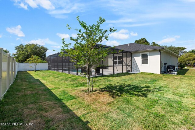 90 Lancelot Dr, Palm Coast, FL 32137 - rear view of house with a lanai, stucco siding, and a patio area