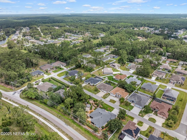 90 Lancelot Dr, Palm Coast, FL 32137 - aerial view of property and surrounding area with a heavily wooded area and nearby suburban area