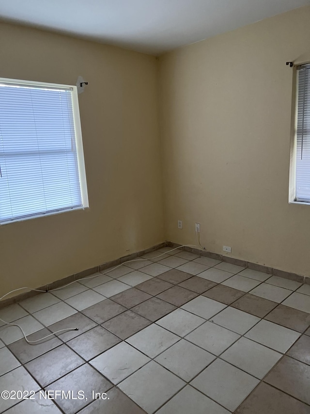 5715 Wiltshire St, Jacksonville, FL 32211 - empty room featuring light tile patterned floors and baseboards