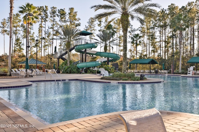 528 Sparrow Branch Cir, Saint Johns, FL 32259 - community pool featuring a water slide and a patio area