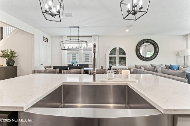 571 Meadow Creek Dr, Saint Johns, FL 32259 - kitchen with a chandelier, open floor plan, and a sink