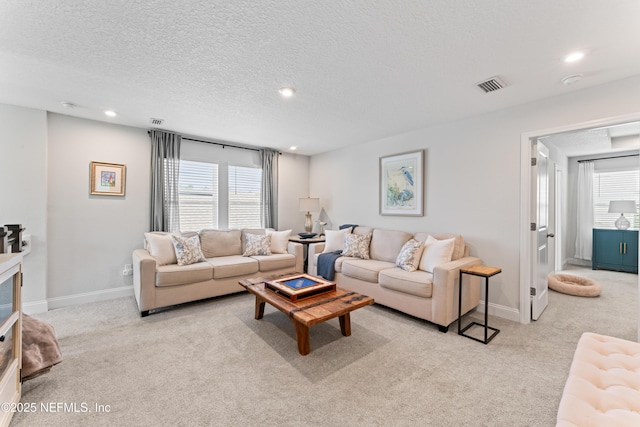 571 Meadow Creek Dr, Saint Johns, FL 32259 - living area with carpet flooring, baseboards, recessed lighting, and a textured ceiling