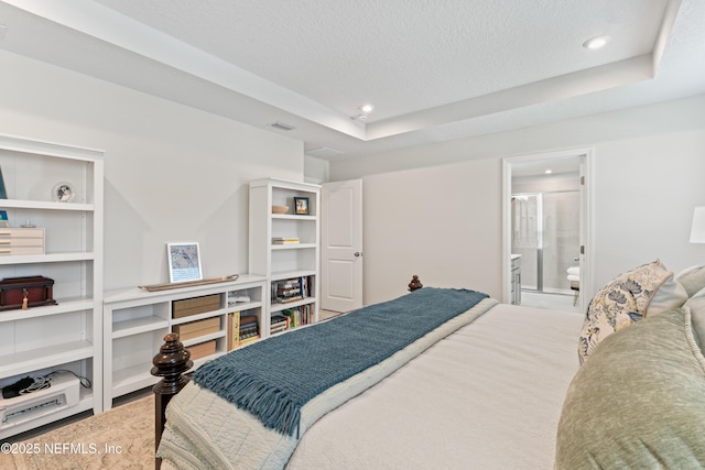 571 Meadow Creek Dr, Saint Johns, FL 32259 - bedroom featuring recessed lighting, a textured ceiling, a tray ceiling, and ensuite bath