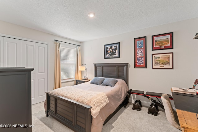 571 Meadow Creek Dr, Saint Johns, FL 32259 - bedroom featuring light carpet, a textured ceiling, baseboards, and a closet