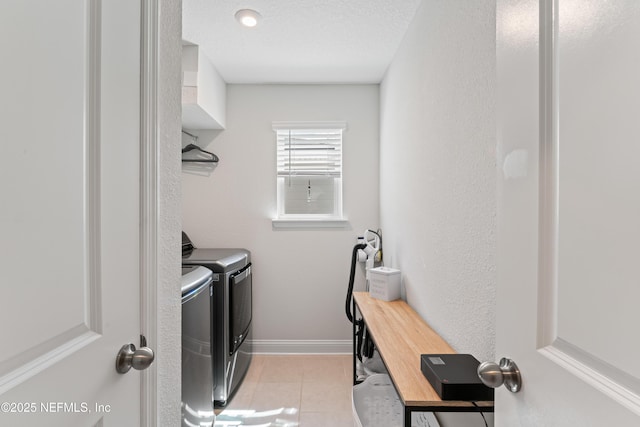 571 Meadow Creek Dr, Saint Johns, FL 32259 - washroom featuring washing machine and dryer, baseboards, light tile patterned floors, and a textured ceiling