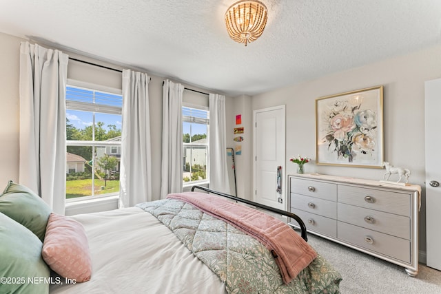 571 Meadow Creek Dr, Saint Johns, FL 32259 - bedroom with light carpet, a textured ceiling, and a chandelier