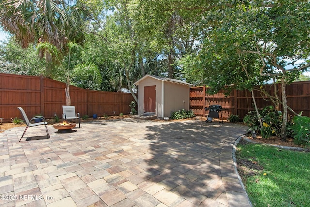 4241 Lexington Ave, Jacksonville, FL 32210 - fenced backyard with a patio area, an outdoor fire pit, and grilling area