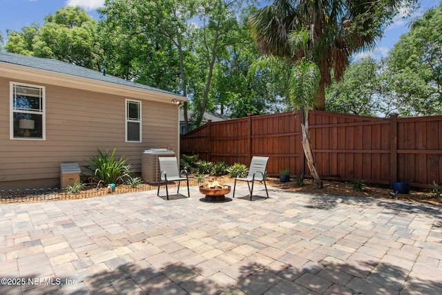 4241 Lexington Ave, Jacksonville, FL 32210 - view of patio / terrace featuring central AC unit and an outdoor fire pit