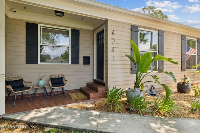 4241 Lexington Ave, Jacksonville, FL 32210 - view of exterior entry featuring a security system