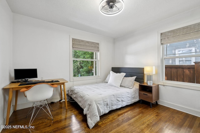 4241 Lexington Ave, Jacksonville, FL 32210 - bedroom featuring wood finished floors, baseboards, and an office area