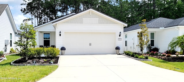 55 Fairlake Cir, Saint Augustine, FL 32092 - view of front of property with concrete driveway, an attached garage, and a front yard