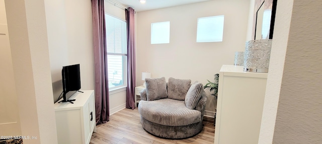 55 Fairlake Cir, Saint Augustine, FL 32092 - sitting room with light wood-style flooring and baseboards