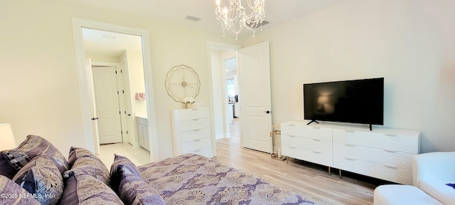 55 Fairlake Cir, Saint Augustine, FL 32092 - bedroom with light wood-style flooring and a chandelier