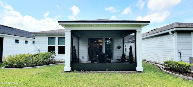 55 Fairlake Cir, Saint Augustine, FL 32092 - rear view of property with a lawn and a sunroom