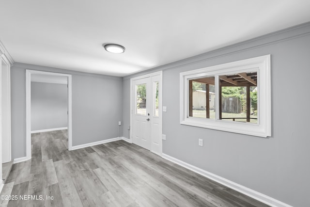 2155 Diana Dr, Palatka, FL 32177 - entryway with baseboards and wood finished floors