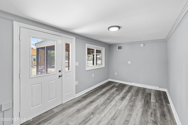 2155 Diana Dr, Palatka, FL 32177 - entrance foyer featuring wood finished floors, baseboards, and ornamental molding