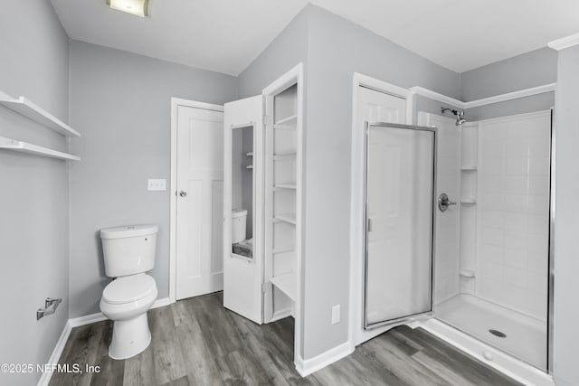 2155 Diana Dr, Palatka, FL 32177 - full bath with wood finished floors, toilet, and a stall shower