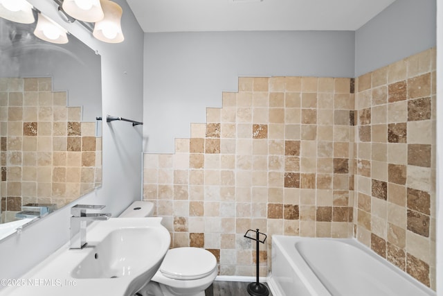 2155 Diana Dr, Palatka, FL 32177 - bathroom with a bath, toilet, a sink, and tile walls