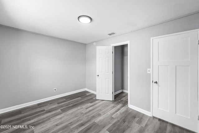 2155 Diana Dr, Palatka, FL 32177 - unfurnished bedroom featuring wood finished floors and baseboards
