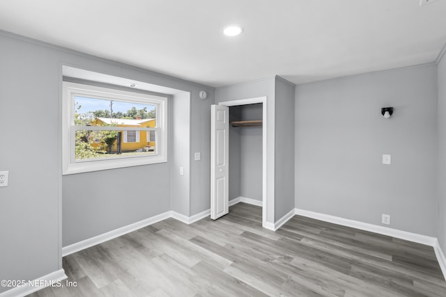 2155 Diana Dr, Palatka, FL 32177 - unfurnished bedroom featuring baseboards, wood finished floors, a closet, and recessed lighting