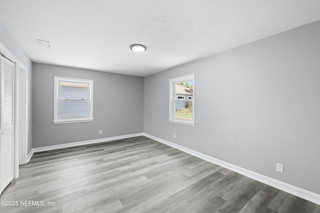 2155 Diana Dr, Palatka, FL 32177 - unfurnished bedroom featuring wood finished floors, a closet, and baseboards