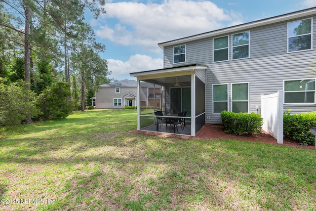 8609 Victoria Falls Dr, Jacksonville, FL 32244 - back of house with a sunroom, a lawn, ceiling fan, and a patio area