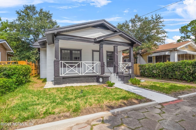 3918 Springfield Blvd, Jacksonville, FL 32206 - view of front facade featuring covered porch and a front lawn