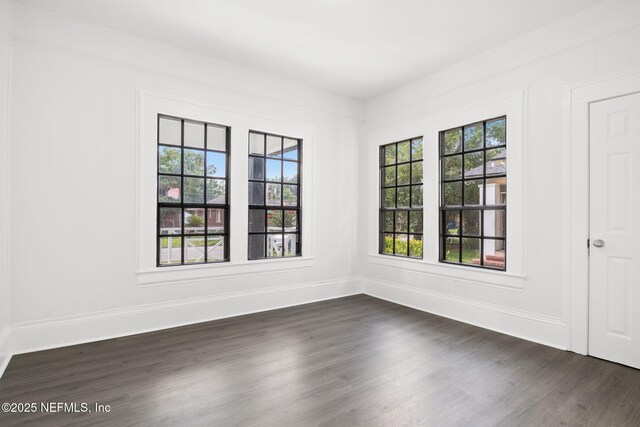 3918 Springfield Blvd, Jacksonville, FL 32206 - empty room featuring dark wood-type flooring and baseboards