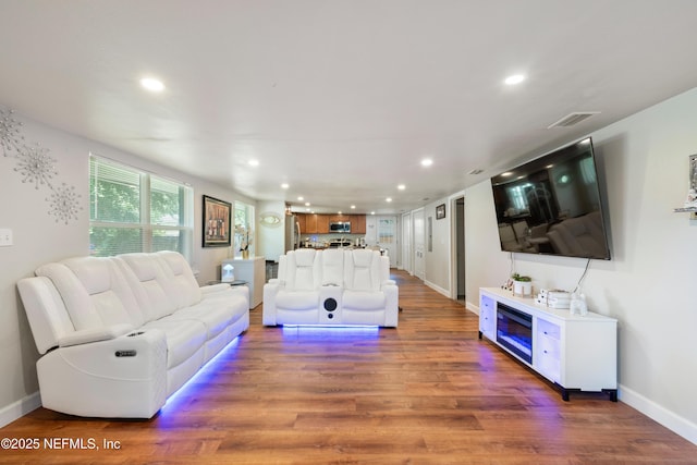 2780 Paul Ave, Jacksonville, FL 32207 - living room with wood finished floors, recessed lighting, and baseboards