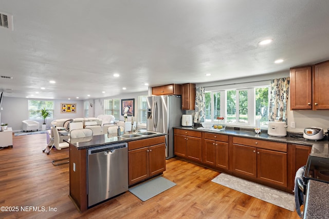 2780 Paul Ave, Jacksonville, FL 32207 - kitchen with stainless steel appliances, open floor plan, dark countertops, and recessed lighting